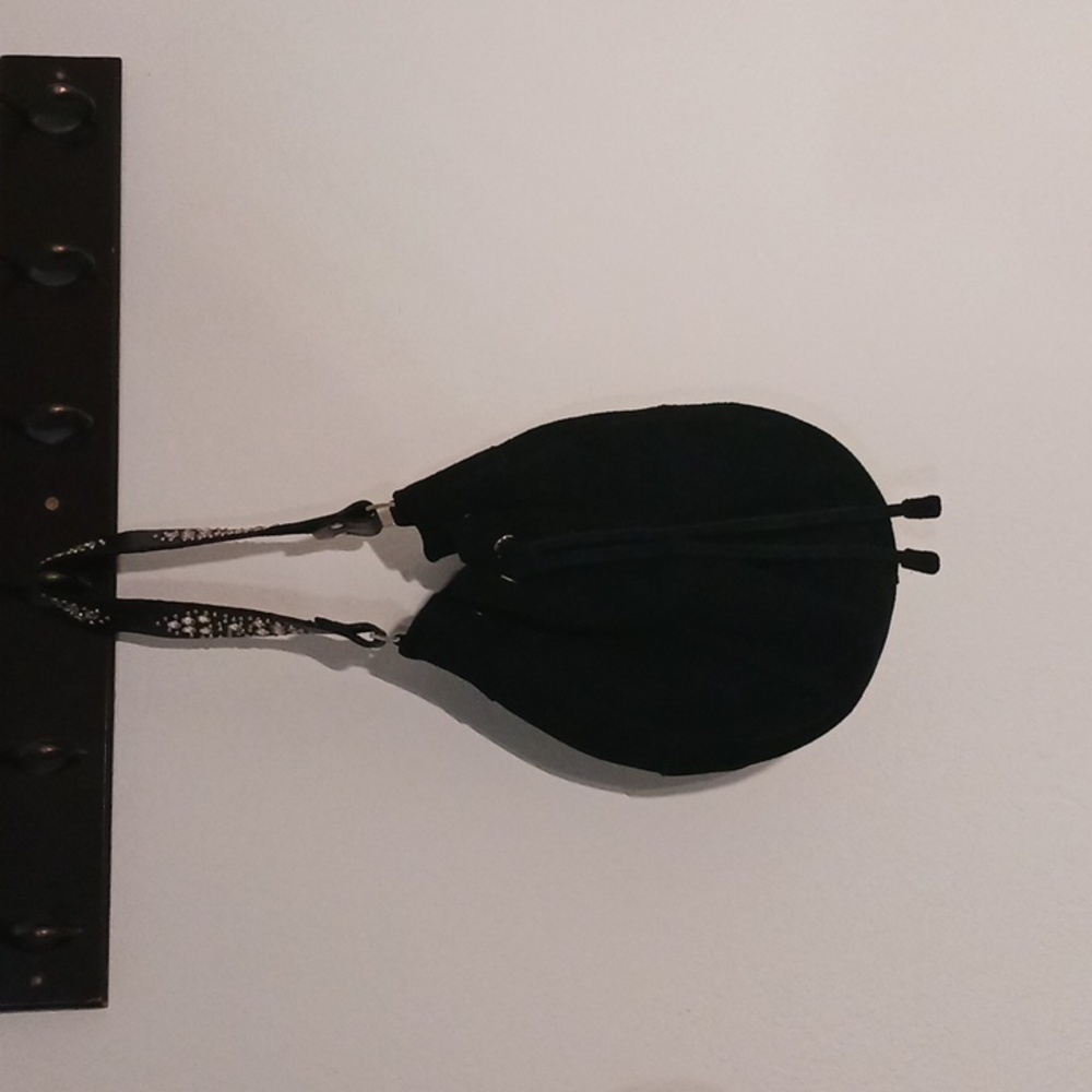 Black suede with leather strap accented with rhinestones. In good used condition